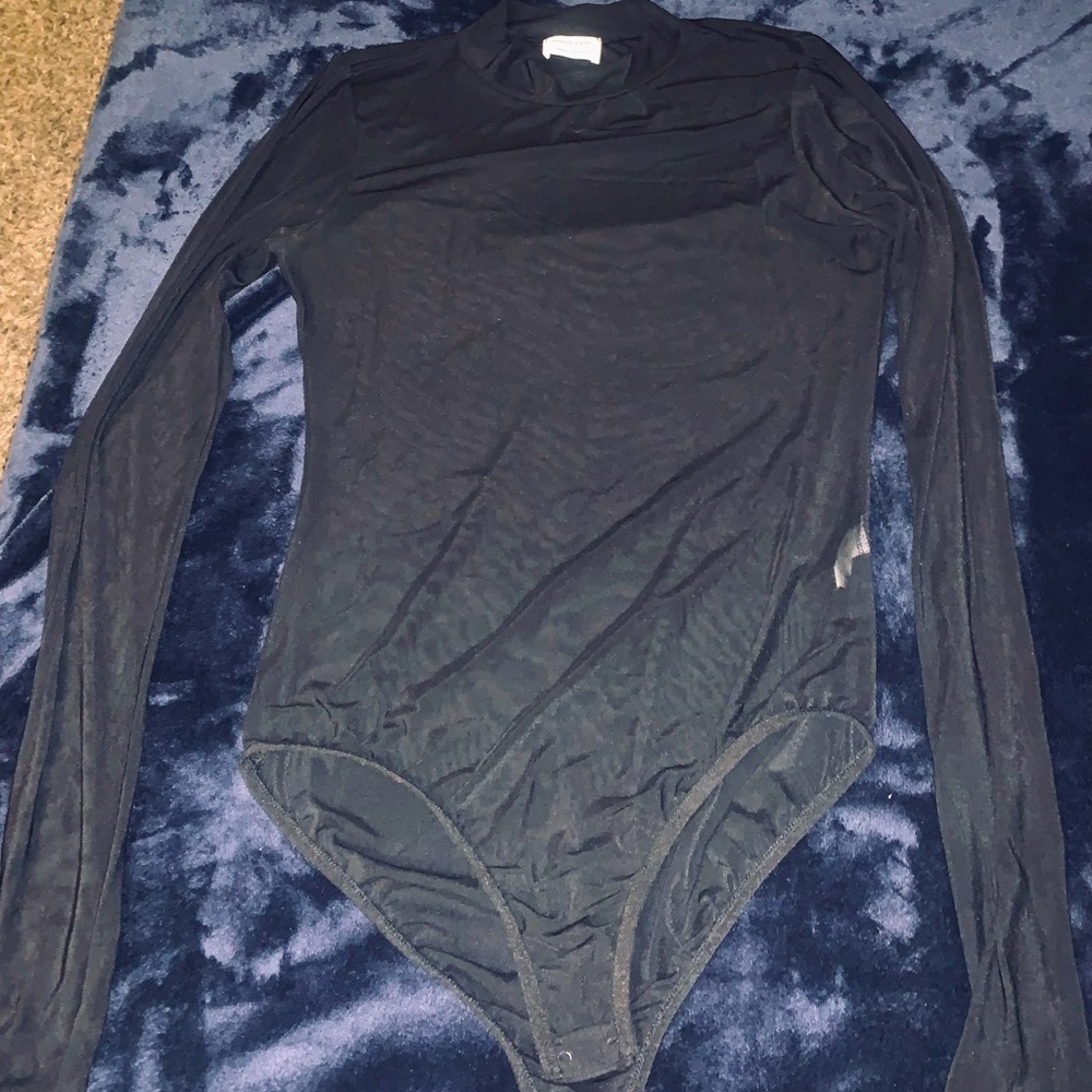 A very cute see through long sleeve black turtle neck